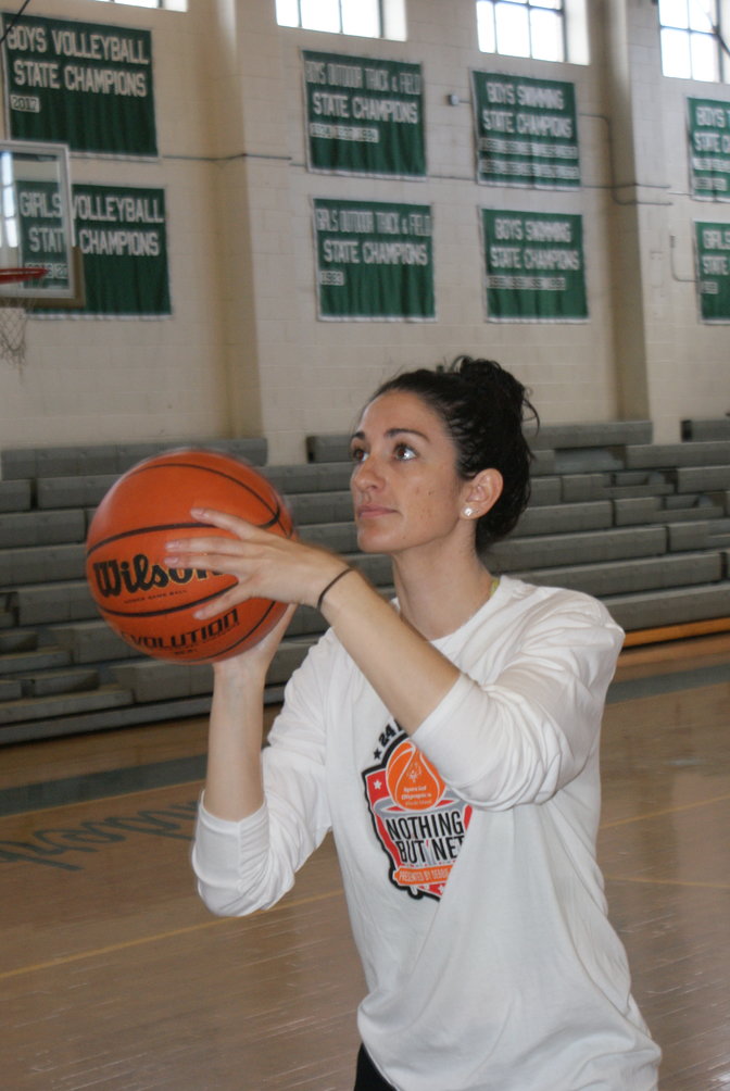 TAKING A SHOT: Stephanie Coro making one of her 2,400 foul shots in the Cranston East Gym within 24 hours.